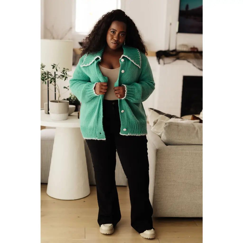 Our relaxed and cozy Ready for Surprises Cardigan features a soft green sweater knit exaggerated shawl collar contrast