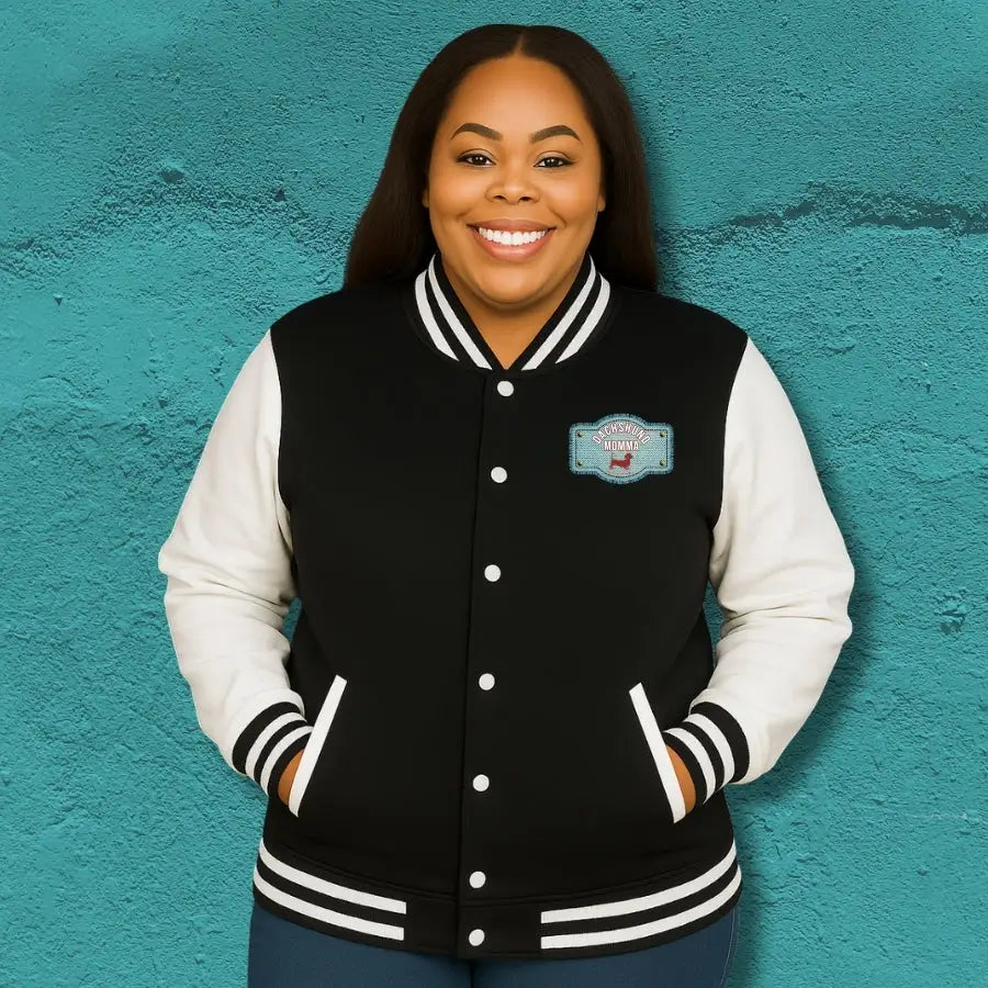 Varsity jacket with Red Dachshund Patch in black colorways. Boutique fit cozy plus size options for stylish dachshund