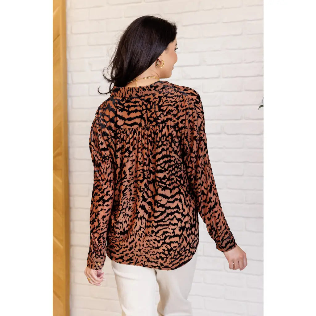 Show off your wild side in our Seriously Fierce Animal Print Blouse. Featuring burnout black velvet animal print