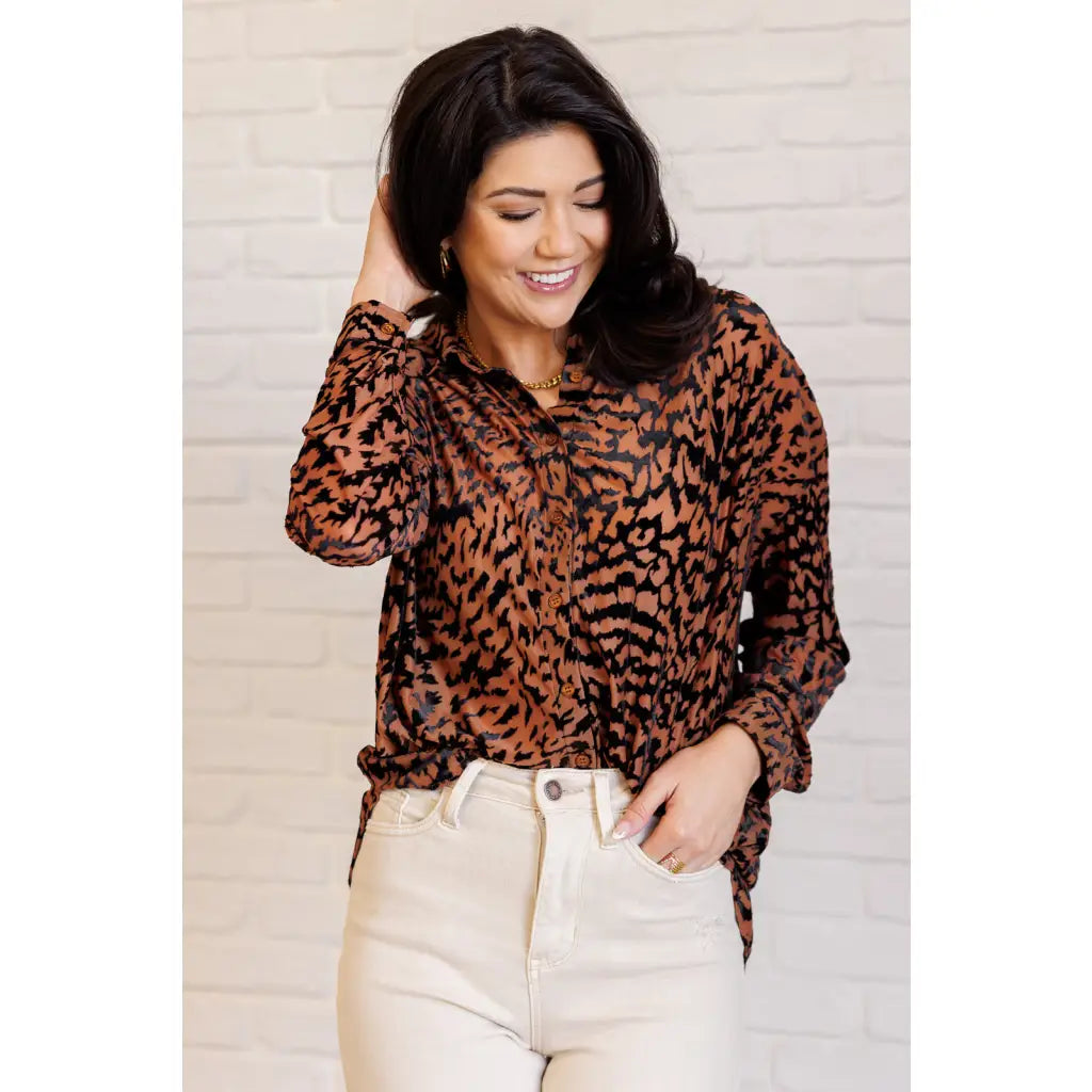 Show off your wild side in our Seriously Fierce Animal Print Blouse. Featuring burnout black velvet animal print