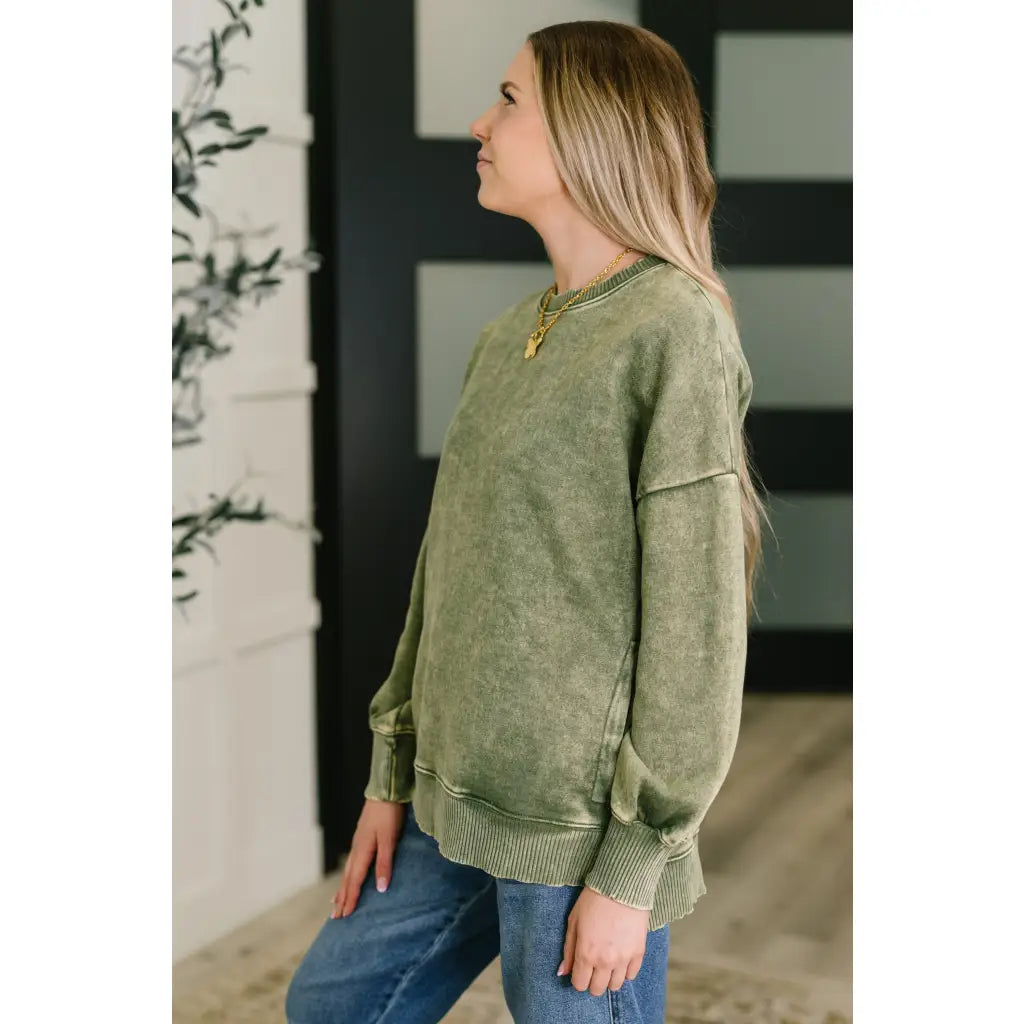 Wrap yourself in cozy vibes with our Stormy Pistachio Latte Pullover! Featuring stretchy fleece drop shoulders