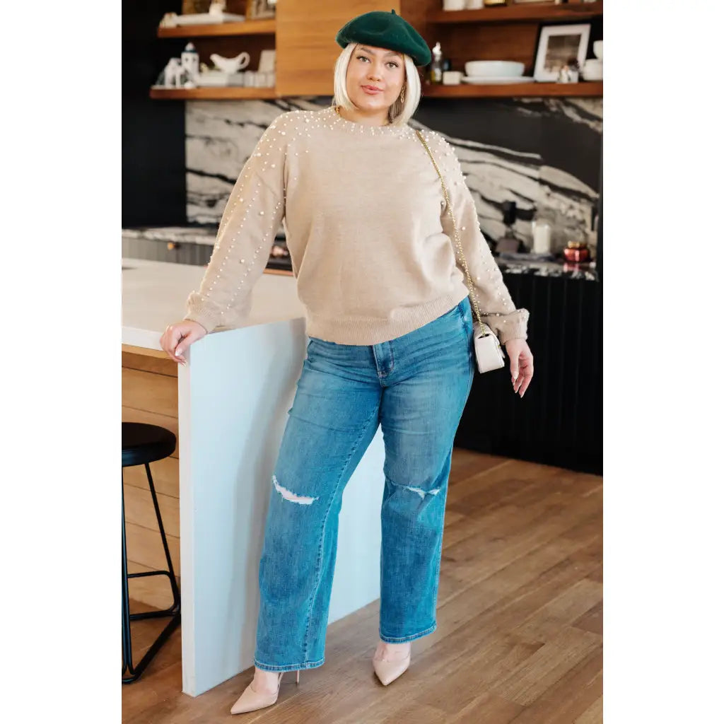 Stay stylish and cozy with our String Me Along Pearl Accent Beige Sweater. Made from lightweight knit this sweater