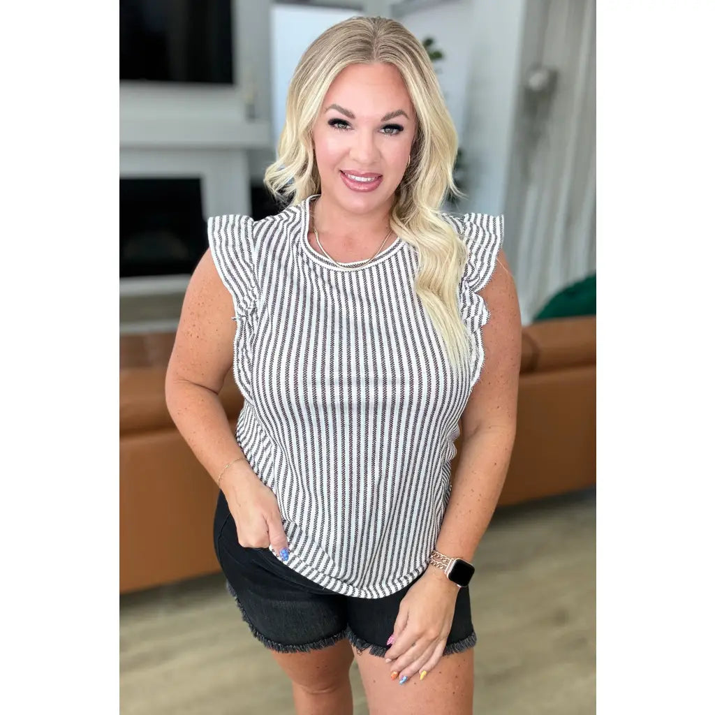 Vertical stripe ruffle sleeve top in soft white and charcoal. Stretchy rib knit boutique texture. SM to 3XL. Ships fast