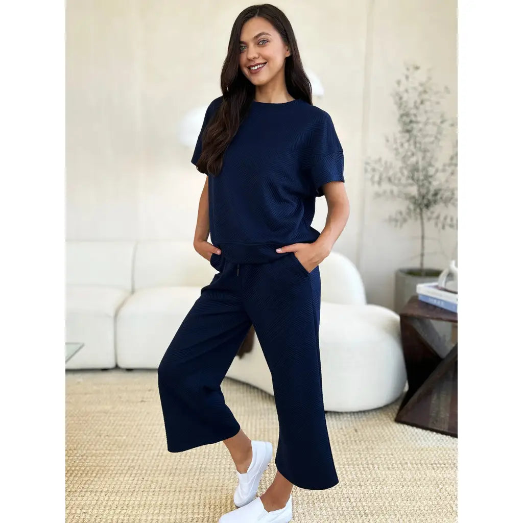 Our Textured Bae Short Sleeve Top and Pants Set is anything but basic. Featuring a drawstring wide leg cropped pant