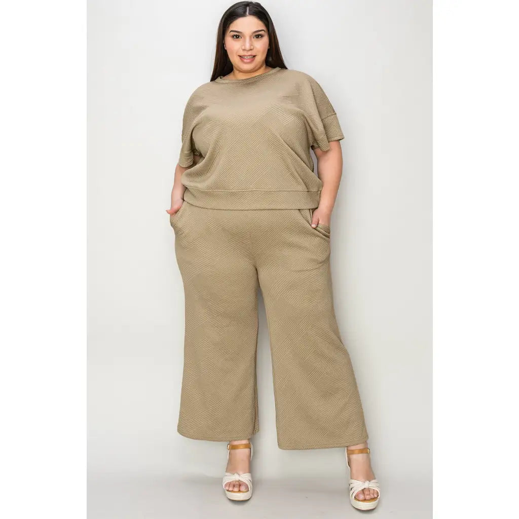 Our Textured Bae Short Sleeve Top and Pants Set is anything but basic. Featuring a drawstring wide leg cropped pant