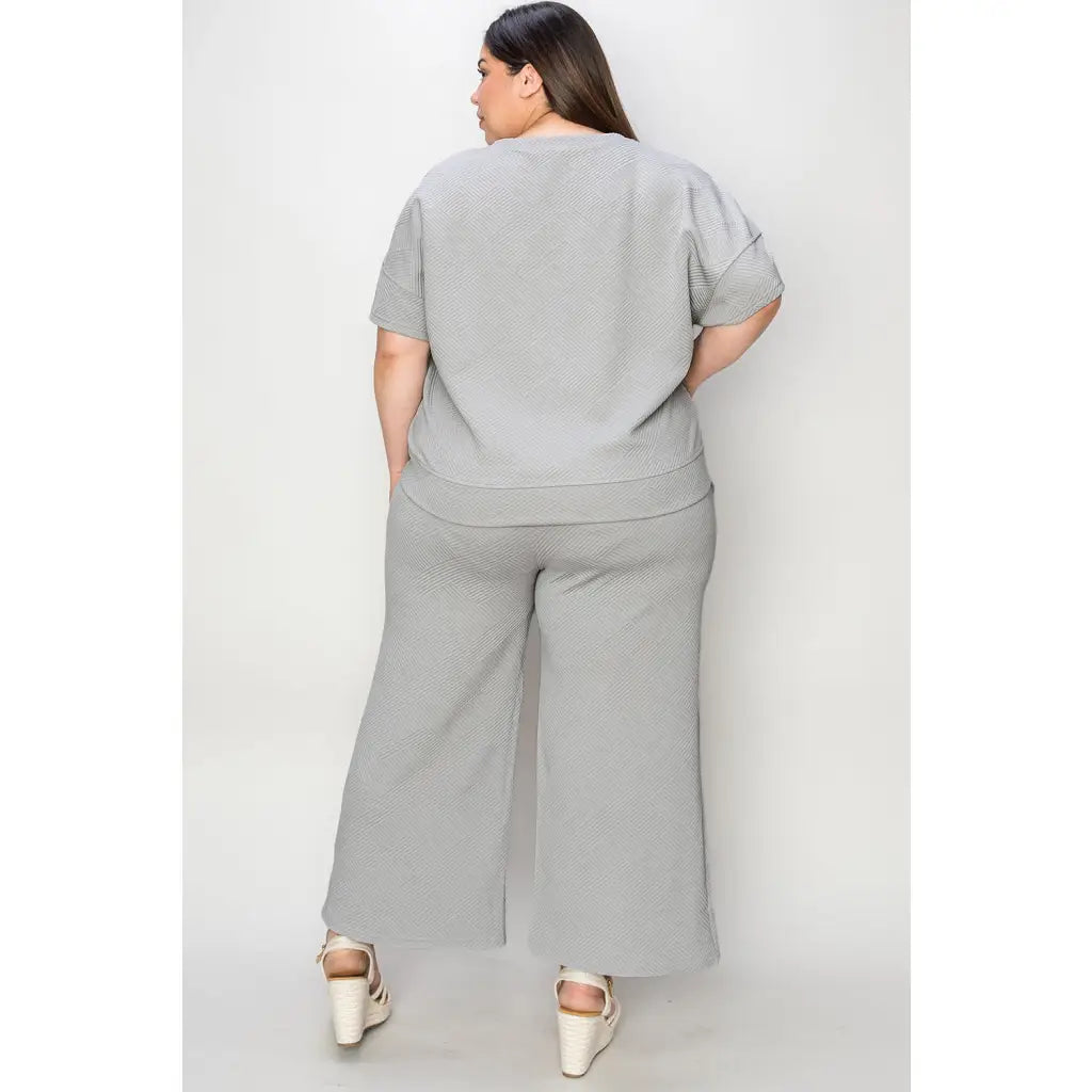 Our Textured Bae Short Sleeve Top and Pants Set is anything but basic. Featuring a drawstring wide leg cropped pant