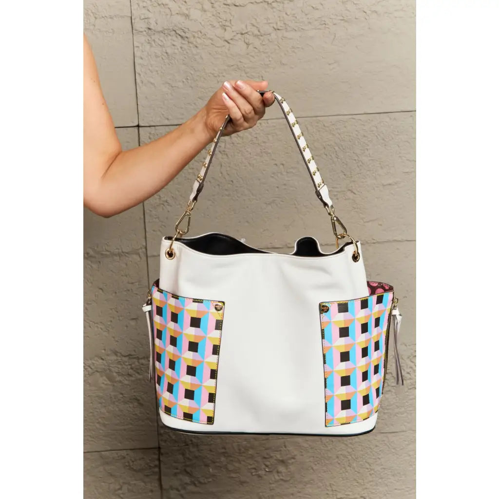 This fantastically fun handbag three piece set includes a Large Shoulder Bag Solid Crossbody and charming Heart Coin