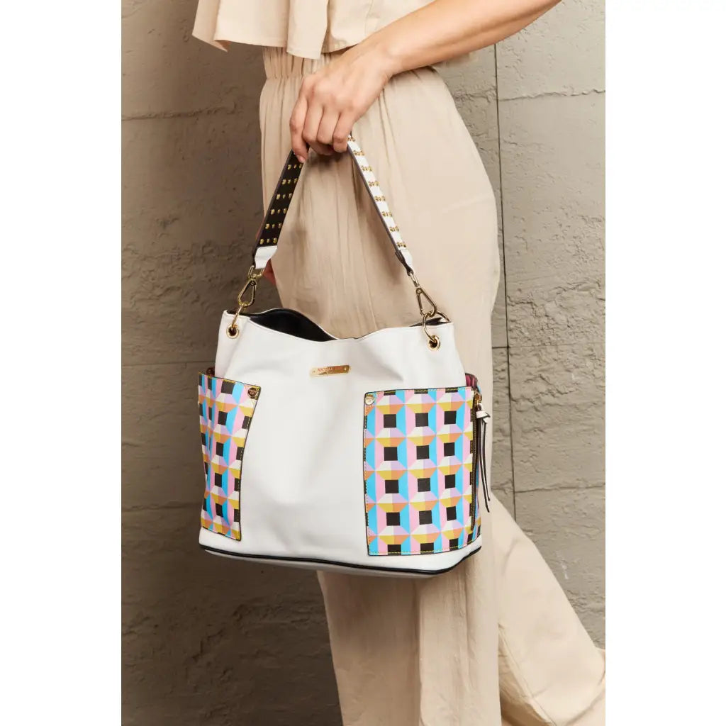 This fantastically fun handbag three piece set includes a Large Shoulder Bag Solid Crossbody and charming Heart Coin