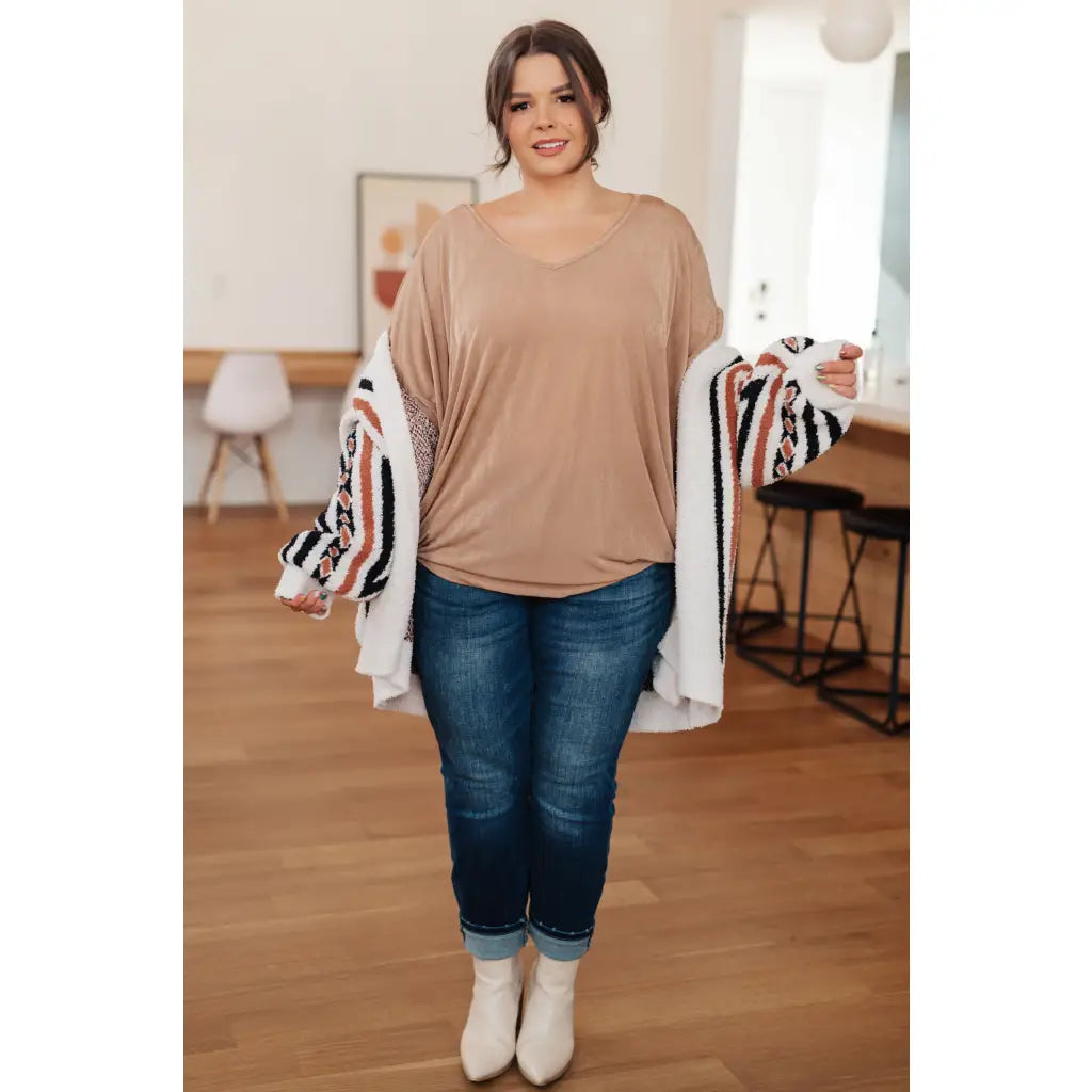 Unleash your style with The Realest V-Neck Top in Shimmering Beige. Made from soft bulgari fabric this top offers