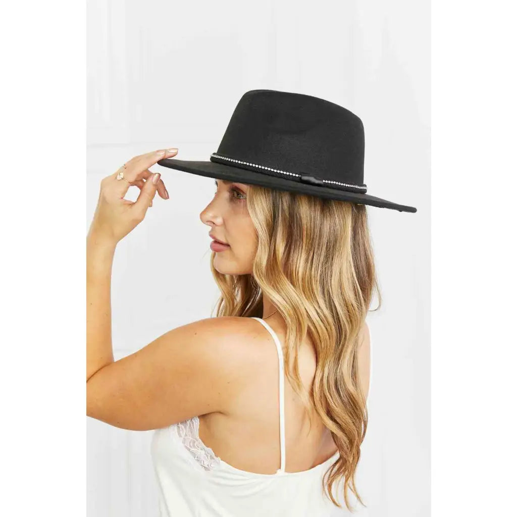 Our Touch of Bling Black Fedora Hat is the perfect accessory for any occasion that requires just a touch sparkle.