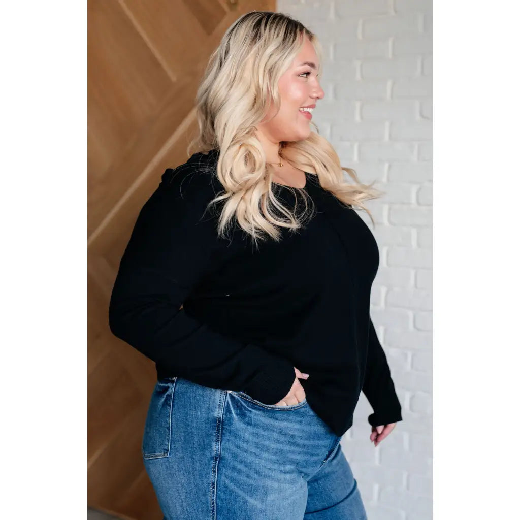 Our V-Neck Front Seam Sweater in black add a stylish touch to your closet! The dropped shoulder and relaxed fit