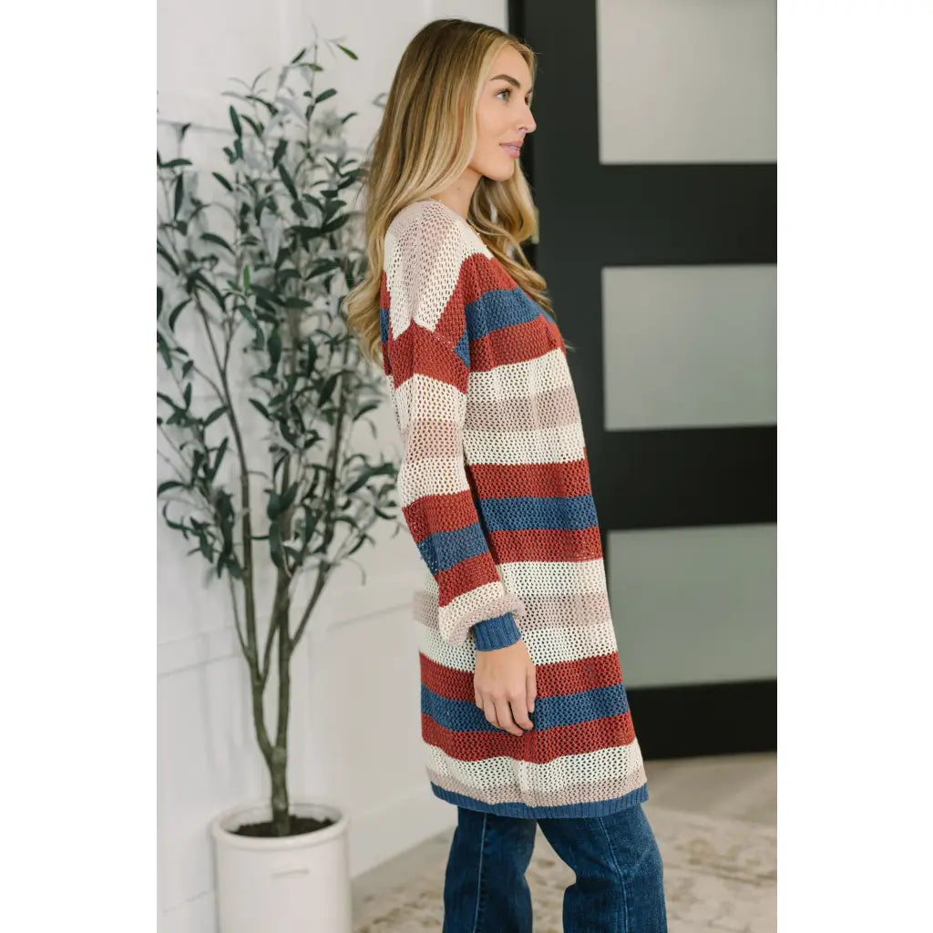 Multicolor striped longline knit cardigan with drop sleeves and open front. Lightweight boutique layering in plus sizes.