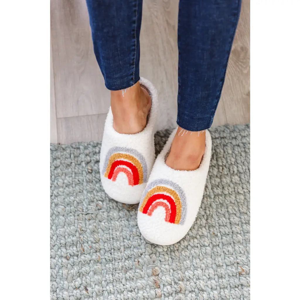 Step your way into comfort with our Warm Hues Rainbow Slippers. Crafted from a warm and fuzzy looped French terry upper