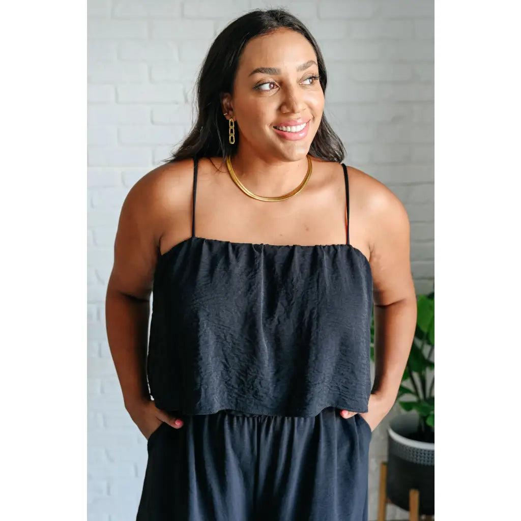 Chic black wide leg jumpsuit with adjustable straps tiered bodice and side pockets. Size inclusive from Small to 3XL