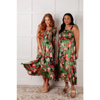 Romantic lush green floral midi dress with a smocked bodice and self-tie straps perfect for spring or summer. Available
