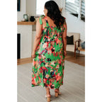 Romantic lush green floral midi dress with a smocked bodice and self-tie straps perfect for spring or summer. Available