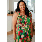 Romantic lush green floral midi dress with a smocked bodice and self-tie straps perfect for spring or summer. Available