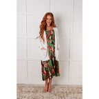 Romantic lush green floral midi dress with a smocked bodice and self-tie straps perfect for spring or summer. Available