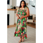 Romantic lush green floral midi dress with a smocked bodice and self-tie straps perfect for spring or summer. Available