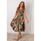 Romantic lush green floral midi dress with a smocked bodice and self-tie straps perfect for spring or summer. Available