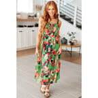 Romantic lush green floral midi dress with a smocked bodice and self-tie straps perfect for spring or summer. Available