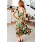 Romantic lush green floral midi dress with a smocked bodice and self-tie straps perfect for spring or summer. Available