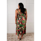 Romantic lush green floral midi dress with a smocked bodice and self-tie straps perfect for spring or summer. Available