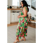 Romantic lush green floral midi dress with a smocked bodice and self-tie straps perfect for spring or summer. Available