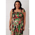 Romantic lush green floral midi dress with a smocked bodice and self-tie straps perfect for spring or summer. Available
