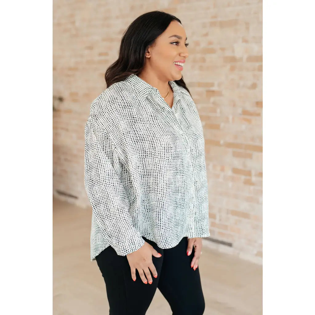 Our Abstract Dots Button Down Blouse features a collared neckline and drop shoulder for classic look. Made
