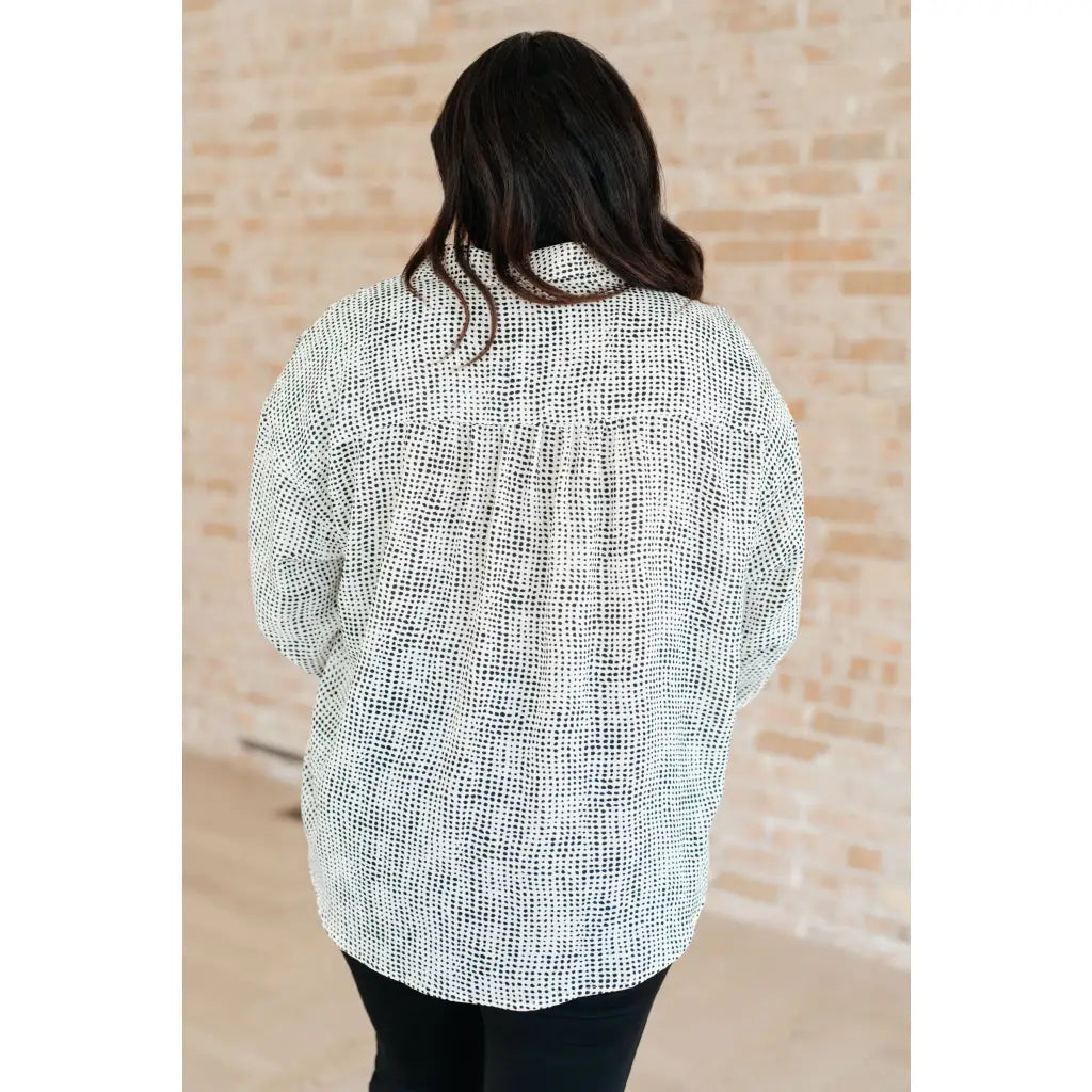 Our Abstract Dots Button Down Blouse features a collared neckline and drop shoulder for classic look. Made