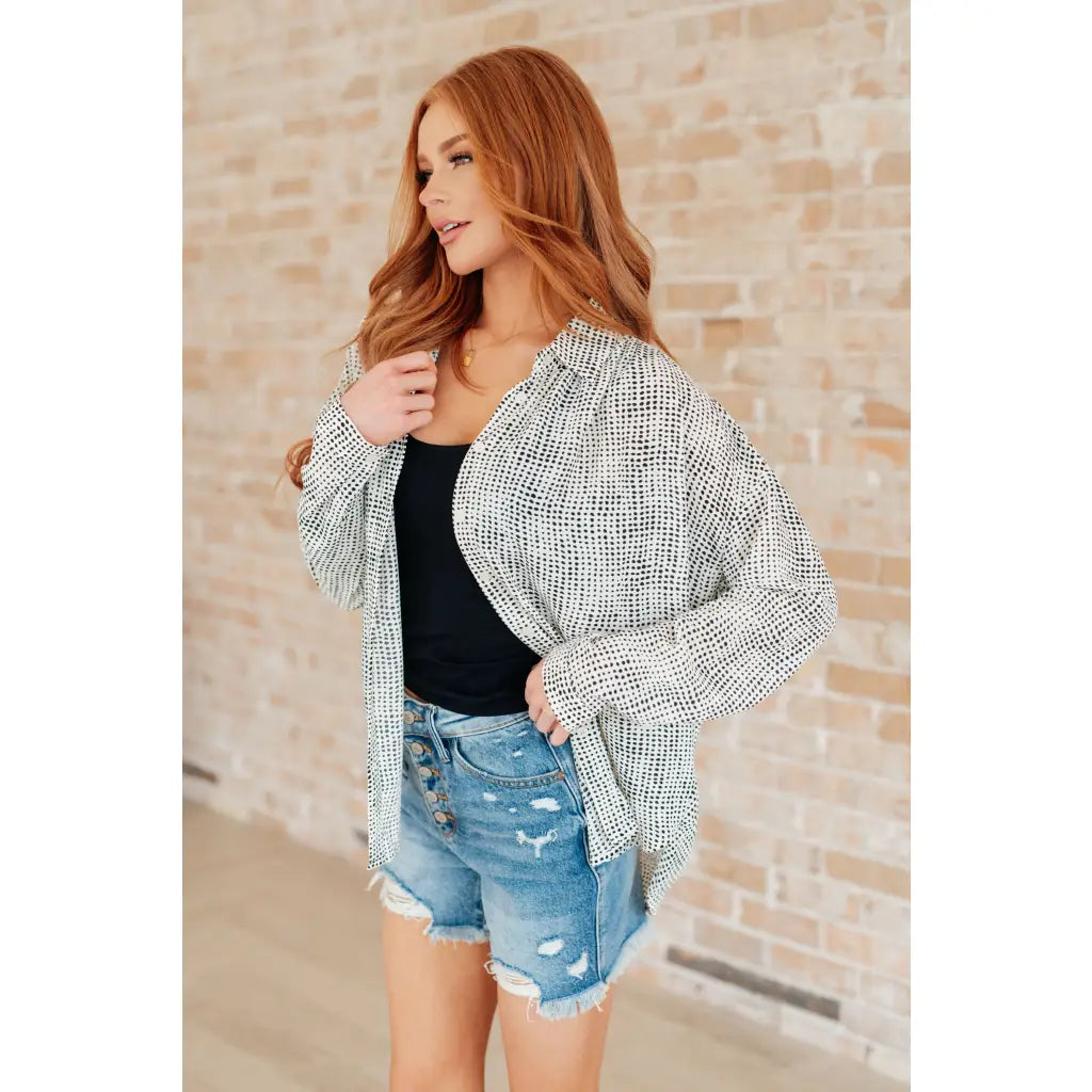 Our Abstract Dots Button Down Blouse features a collared neckline and drop shoulder for classic look. Made