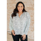 Our Abstract Dots Button Down Blouse features a collared neckline and drop shoulder for classic look. Made