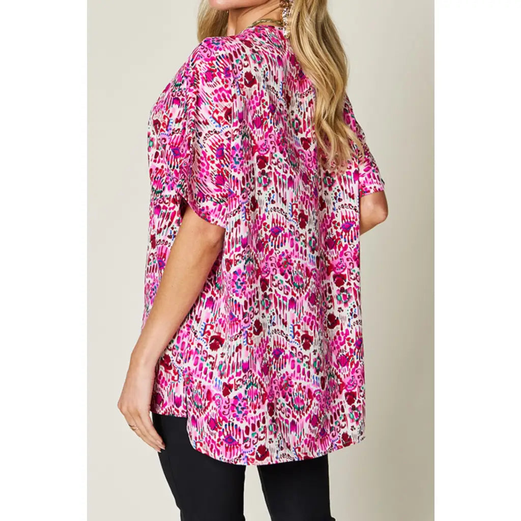 Stay stylish at work and beyond with the Abstractly Mine Printed V-Neck Short Sleeve Blouse. Lightweight breathable