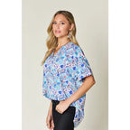 Stay stylish at work and beyond with the Abstractly Mine Printed V-Neck Short Sleeve Blouse. Lightweight breathable