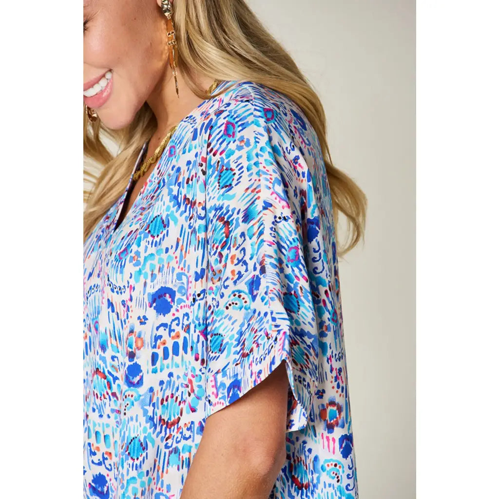 Stay stylish at work and beyond with the Abstractly Mine Printed V-Neck Short Sleeve Blouse. Lightweight breathable