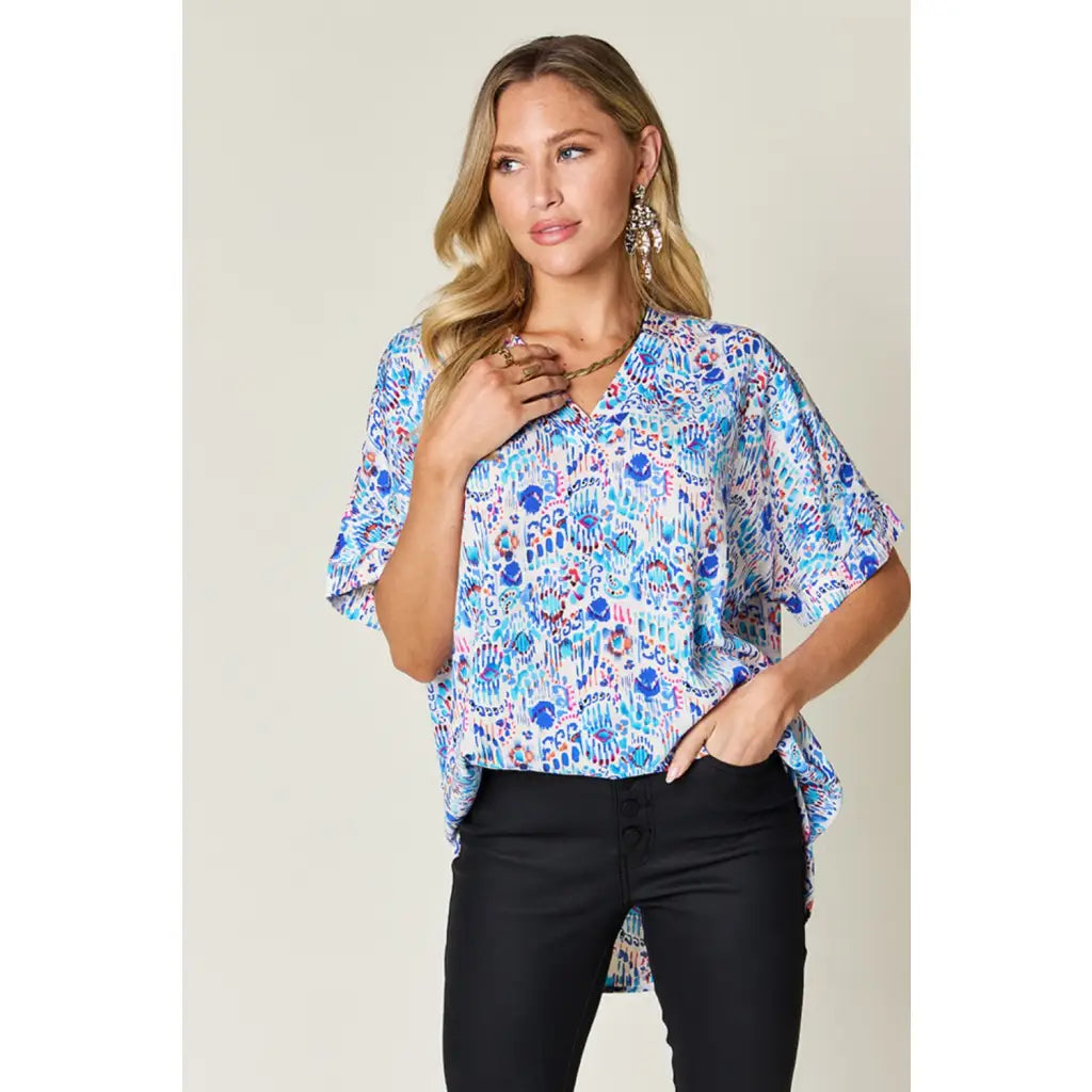Stay stylish at work and beyond with the Abstractly Mine Printed V-Neck Short Sleeve Blouse. Lightweight breathable