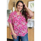 Stay stylish at work and beyond with the Abstractly Mine Printed V-Neck Short Sleeve Blouse. Lightweight breathable
