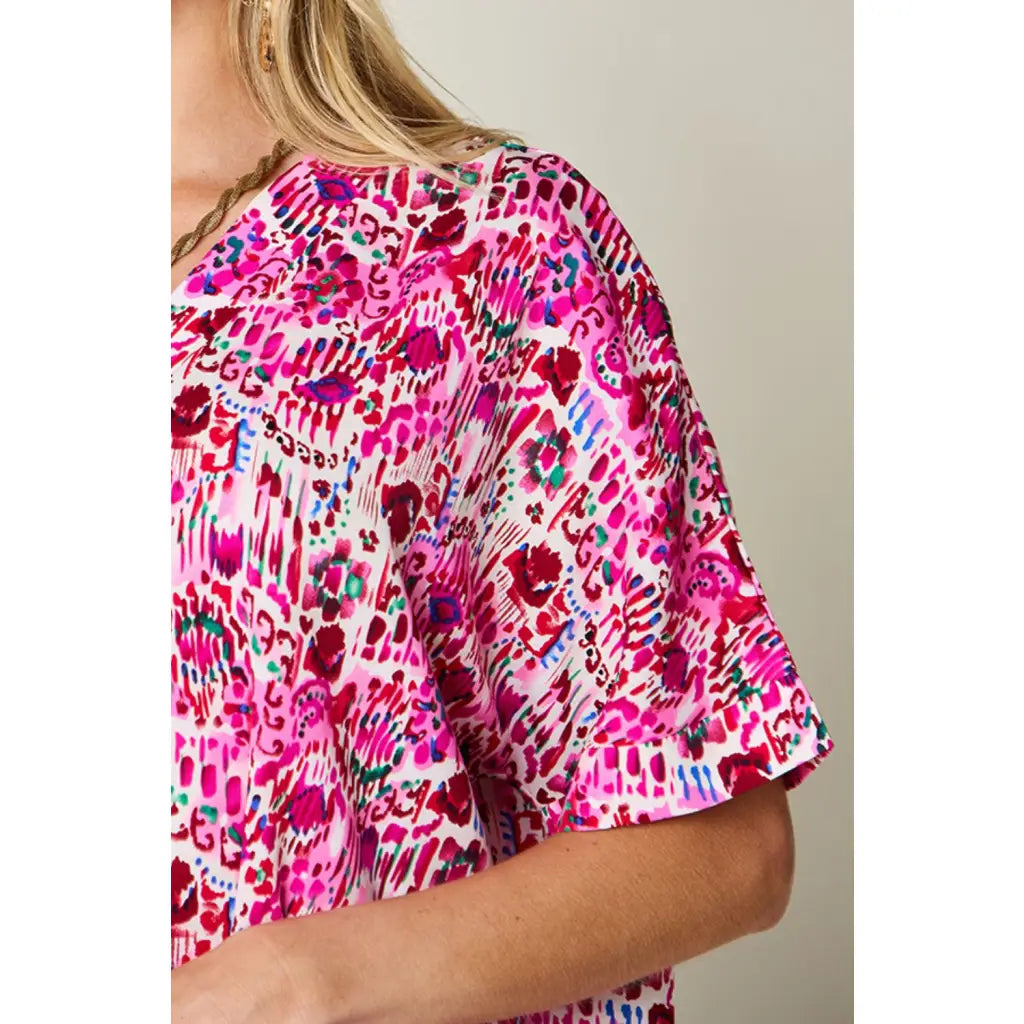 Stay stylish at work and beyond with the Abstractly Mine Printed V-Neck Short Sleeve Blouse. Lightweight breathable