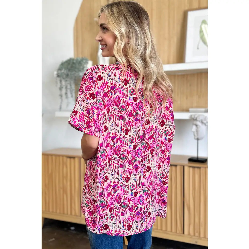 Stay stylish at work and beyond with the Abstractly Mine Printed V-Neck Short Sleeve Blouse. Lightweight breathable