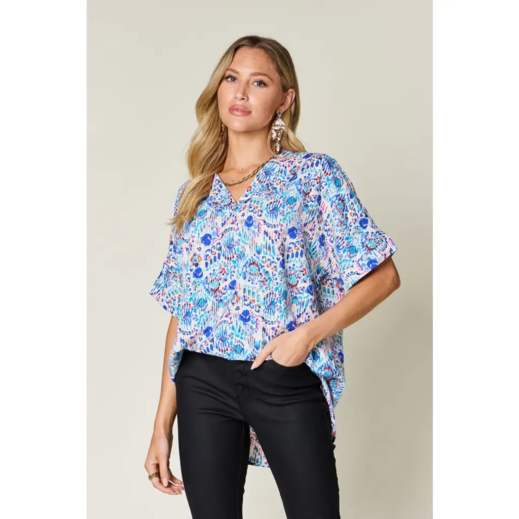 Stay stylish at work and beyond with the Abstractly Mine Printed V-Neck Short Sleeve Blouse. Lightweight breathable