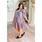 Shop this floral tiered mini dress with flowy fit and boho style. Available in standard plus sizes for a comfortable