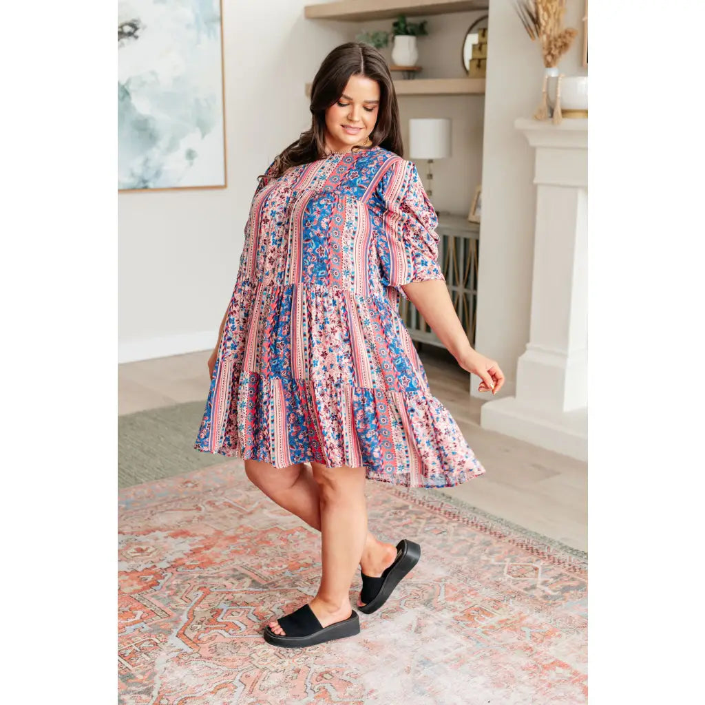 Shop this floral tiered mini dress with flowy fit and boho style. Available in standard plus sizes for a comfortable