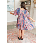 Shop this floral tiered mini dress with flowy fit and boho style. Available in standard plus sizes for a comfortable