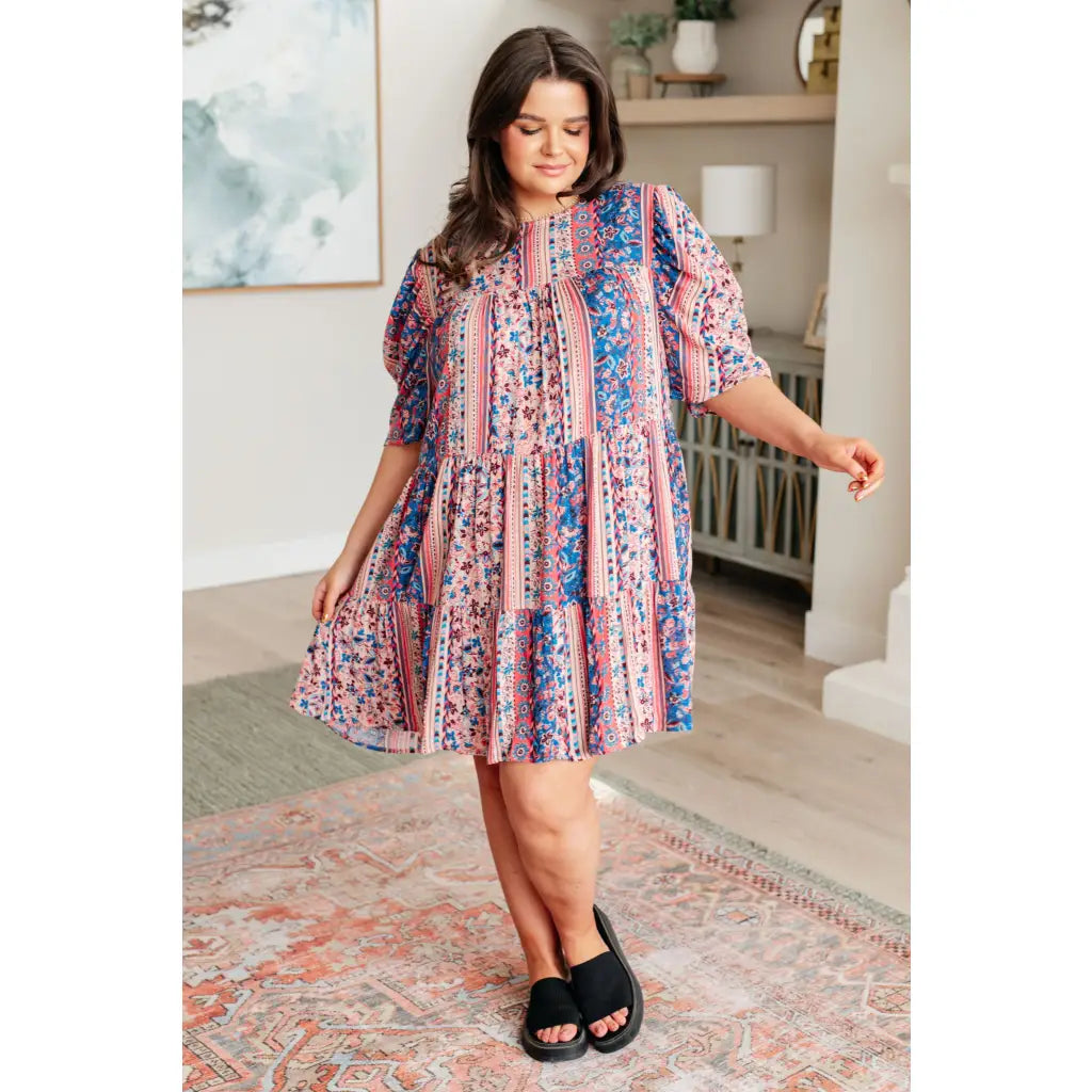 Shop this floral tiered mini dress with flowy fit and boho style. Available in standard plus sizes for a comfortable