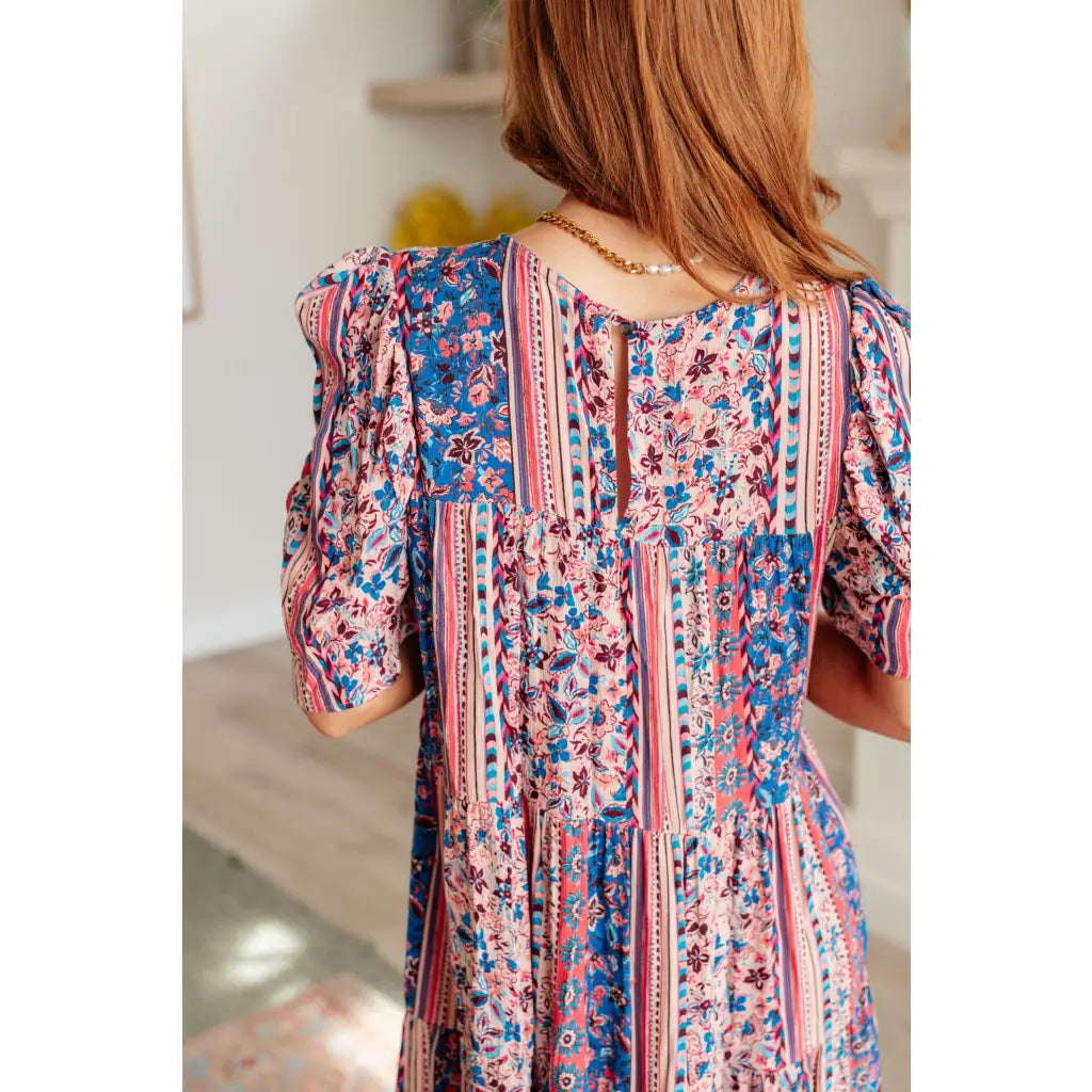 Shop this floral tiered mini dress with flowy fit and boho style. Available in standard plus sizes for a comfortable