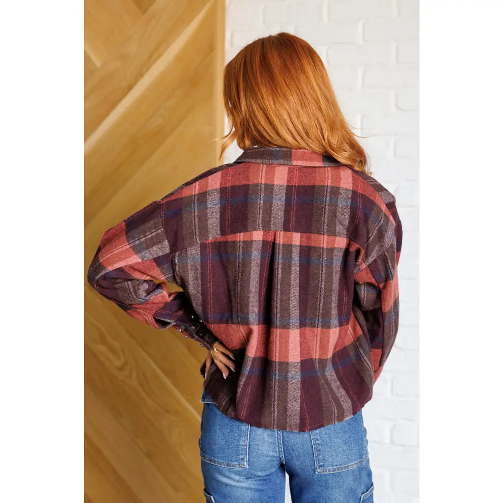 Our Already There Plaid Cropped Shacket is crafted from a brushed mid weight flannel in shades of orange rust and brown