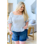 Shop the Serenity in Stripes Smocked Top. Blue and white cotton smocked fit puff sleeves boutique chic. Available