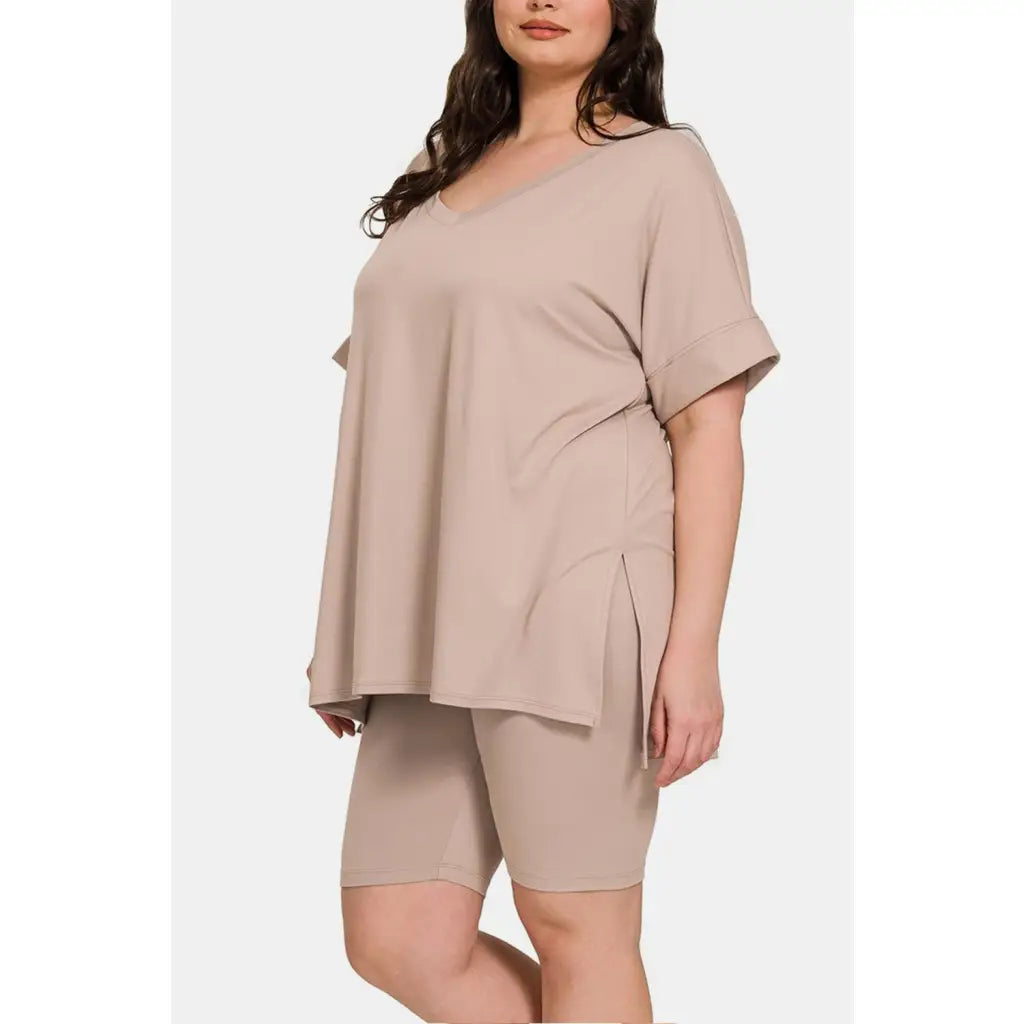 Stay cool and comfortable in our Ash Mocha Comfy Vibes Shorts Set! The short sleeve slit oversized t-shirt long line