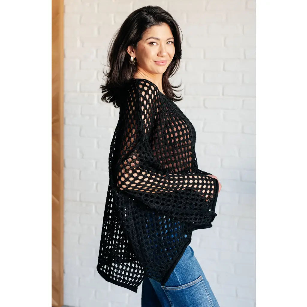 Reel in some serious style with our Ask Anyway Fishnet Sweater. Its boat neckline dropped shoulder side slits and black